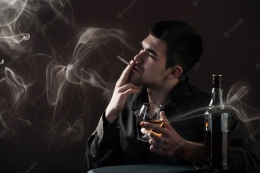 sad-young-man-beats-alcoholic-drink-from-chicken-sitting-dark-room-black-background_212944-5952-min