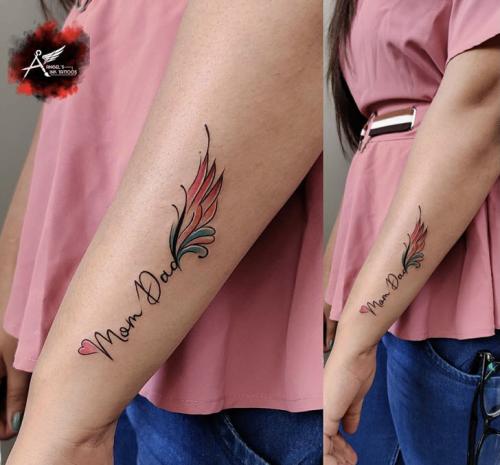 mom dad tattoo on hand for girl